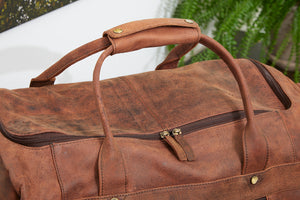 Corium Hunter trolleytaske i brunt læder med hjul